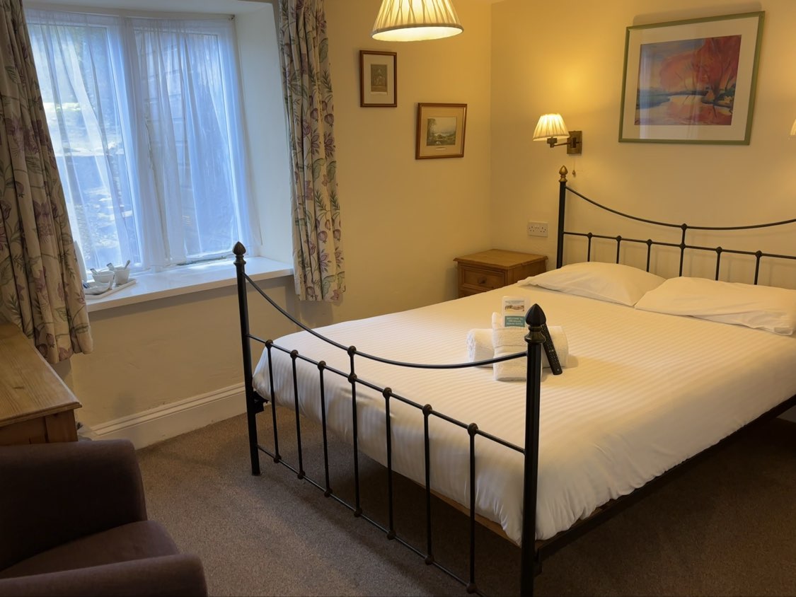 A classic double bedroom at Trehellas House